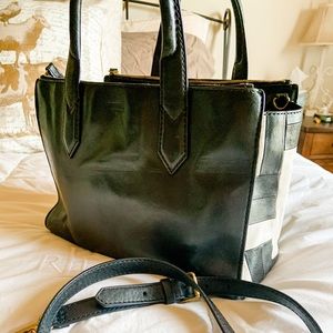 Black leather Fossil handbag with geometric siding